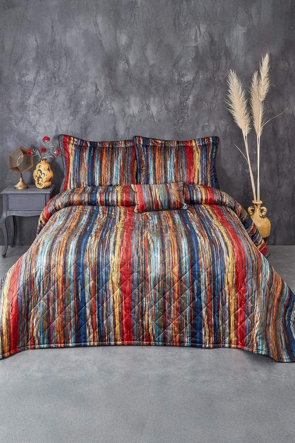 Juego de colcha y fundas de almohada para cama doble con rayas de colores en un dormitorio moderno